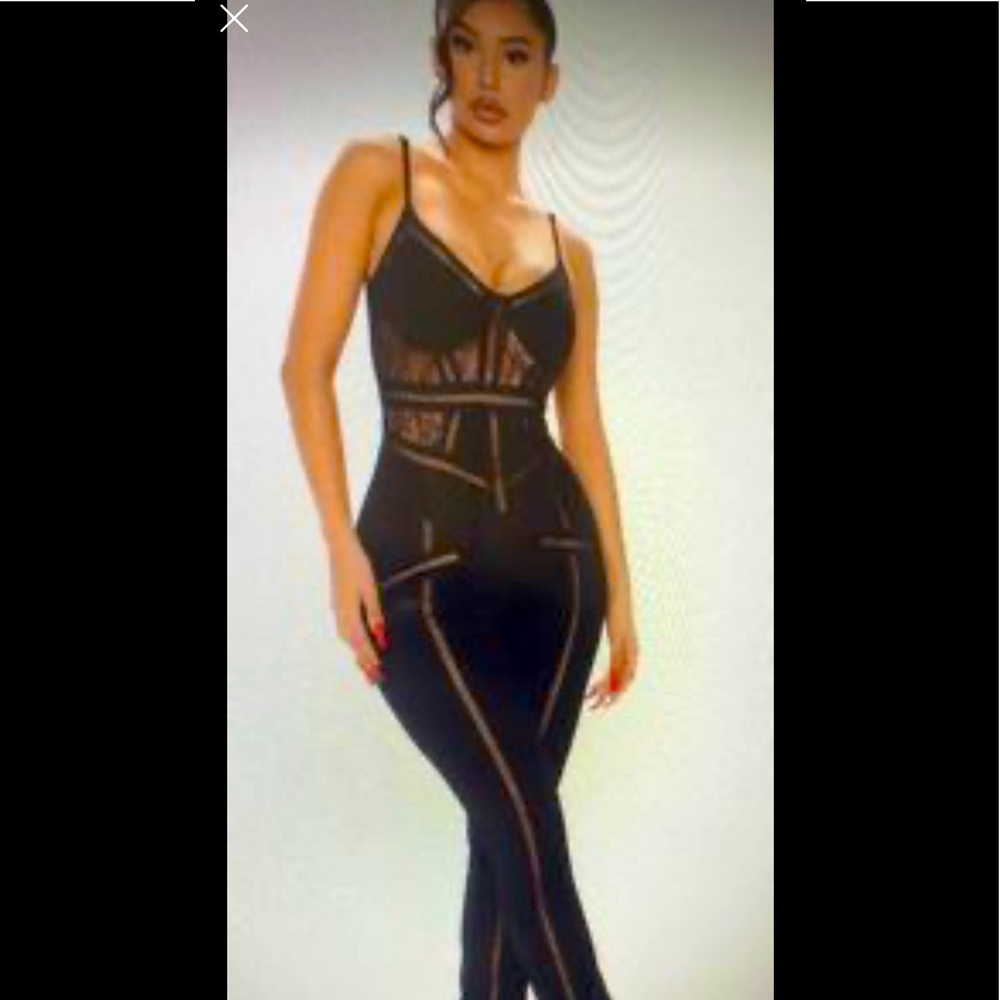Black jumpsuit super cute and new with tags. Originally $59.99